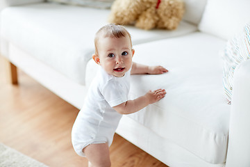 Image showing happy little baby boy or girl at home