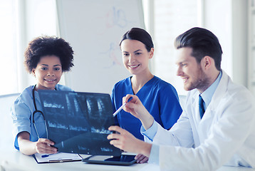 Image showing group of happy doctors discussing x-ray image