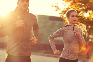 Image showing couple running outdoors