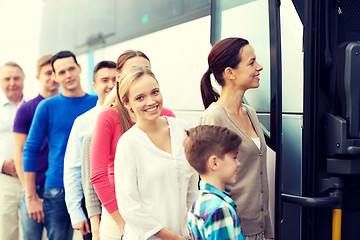 Image showing group of happy passengers boarding travel bus