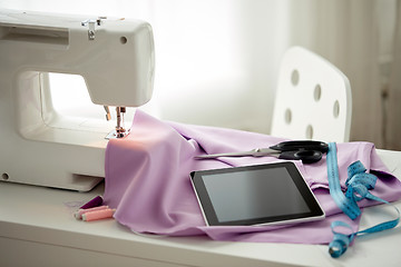 Image showing sewing machine, tablet pc, scissors and ruler