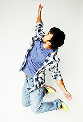 Image showing young pretty asian man jumping cheerful against white background