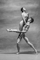 Image showing Couple of ballet dancers posing over gray background