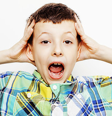 Image showing young pretty little cute boy kid wondering, posing emotional face isolated on white background, gesture happy smiling close up, lifestyle real people concept