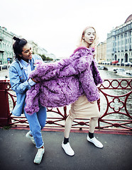 Image showing Two teenage girls infront of university building smiling, having fun traveling europe, lifestyle people concept 