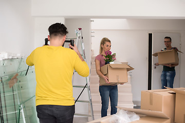 Image showing young couple moving into a new home