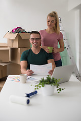 Image showing Young couple moving in a new home