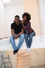 Image showing couple having break during moving to new house