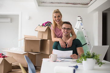 Image showing Young couple moving in a new home