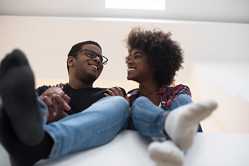 Image showing couple having break during moving to new house