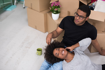 Image showing African American couple relaxing in new house