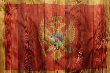 Image showing National flag of Montenegro, wooden background