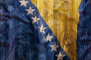 Image showing National flag of Bosnia and herzegovina, wooden background