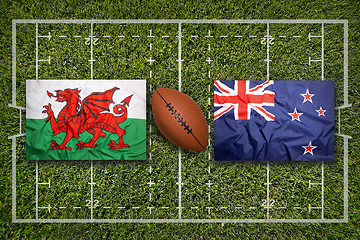 Image showing Wales vs. New Zealand flags on rugby field