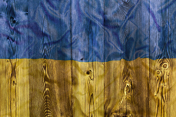 Image showing National flag of Ukraine, wooden background