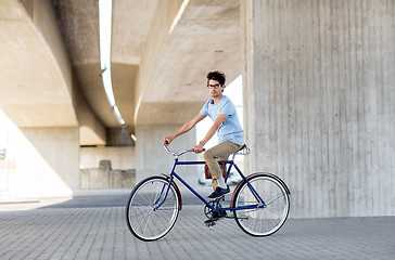 Image showing young hipster man riding fixed gear bike