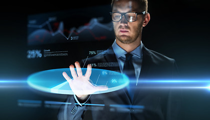 Image showing businessman touching virtual chart projection