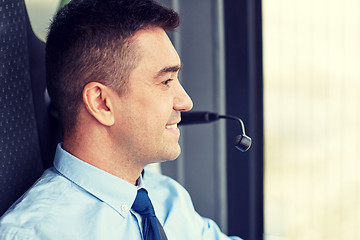 Image showing happy bus driver face with microphone