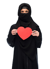 Image showing muslim woman in hijab holding red heart