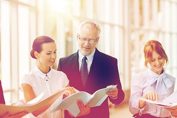 Image showing business team with folders meeting at office