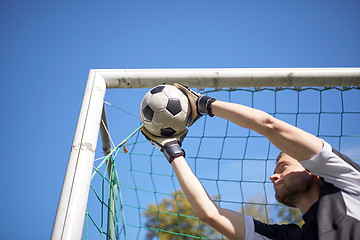 Image showing goalkeeper with ball at football goal on field