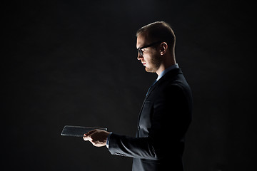 Image showing close up of businessman with transparent tablet pc