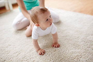 Image showing mother with baby on floor at home