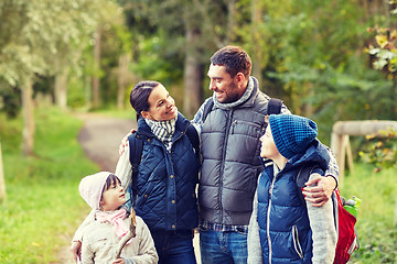 Image showing happy family with backpacks hiking