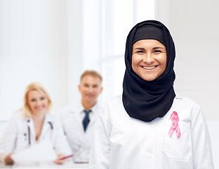 Image showing muslim doctor with breast cancer awareness ribbon