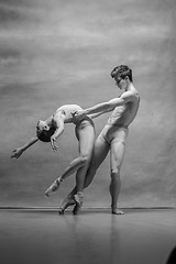 Image showing Couple of ballet dancers posing over gray background