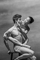 Image showing Couple of ballet dancers posing over gray background