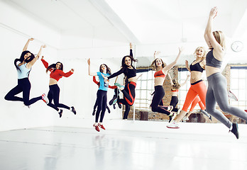 Image showing Women doing sport in gym, jumping, healthcare lifestyle people concept, modern loft studio 