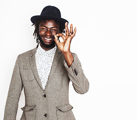 Image showing young handsome afro american boy in stylish hipster hat gesturing emotional isolated on white background smiling, lifestyle people concept 