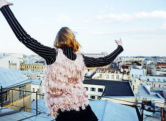 Image showing young pretty fashion lady on roof top having fun party time, lifestyle people concept 