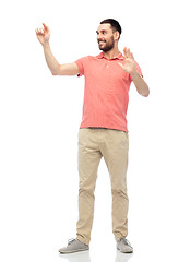 Image showing happy man touching something imaginary