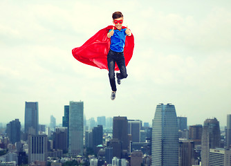 Image showing boy in super hero cape and mask showing thumbs up