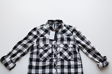 Image showing close up of checkered shirt on white background