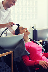 Image showing happy young woman at hair salon