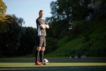 Image showing soccer player with ball on football field