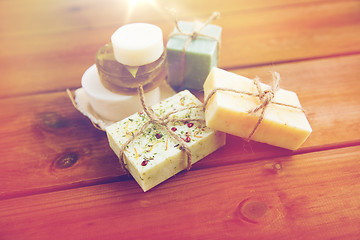 Image showing close up of handmade soap bars on wood