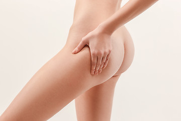 Image showing Checking cellulite. Young, slim, healthy and beautiful woman