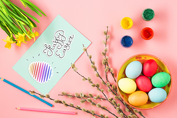 Image showing The top view of easter on pink table office workplace