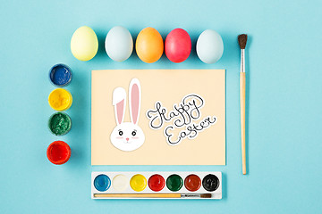 Image showing The top view of easter on blue table office workplace