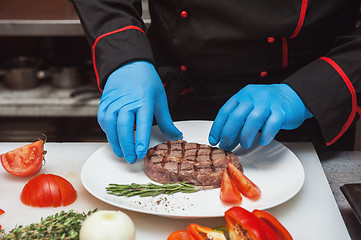 Image showing Chef set grilled meat