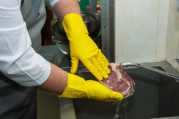 Image showing washing and cleaning meat