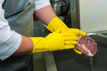 Image showing washing and cleaning meat