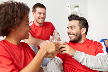 Image showing happy football fans or friends with beer at home