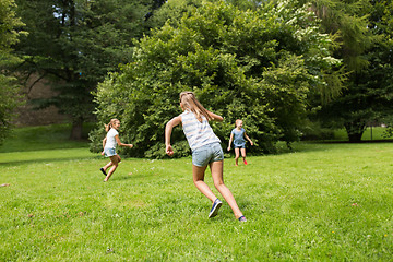 Image showing group of happy kids or friends playing outdoors