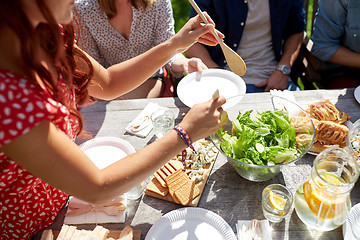 Image showing happy friends having dinner at summer party