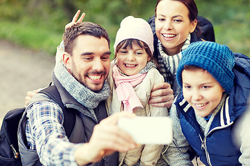 Image showing family taking selfie with smartphone in woods